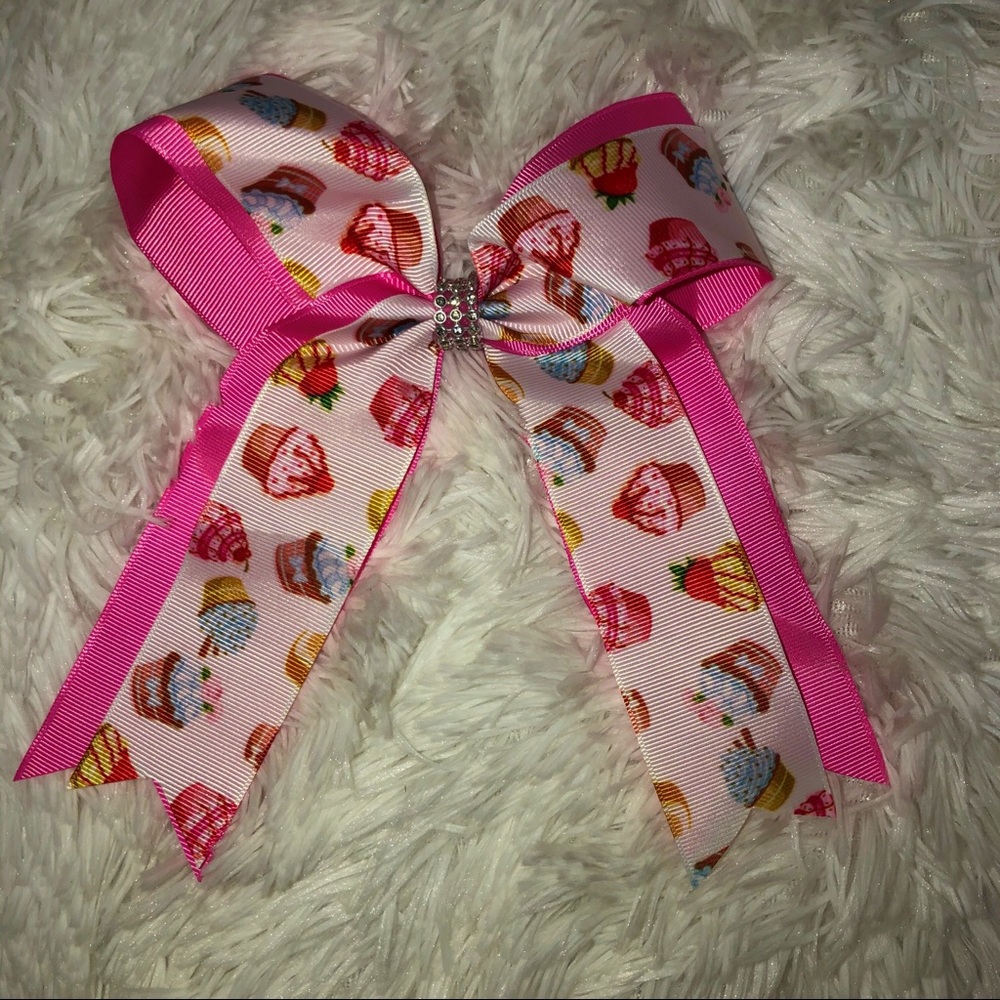 Handmade hot pink bow with cupcake design